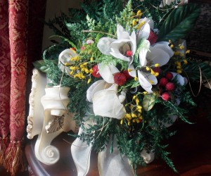 CHRISTMAS BOUQUET WITH WHITE MAGNOLIAS AND RED BERRIES